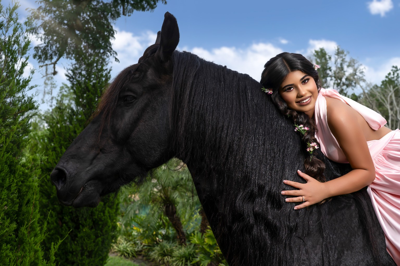 Ilyana embracing a black horse
